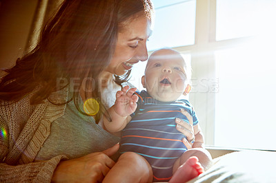 Buy stock photo Shot of a mother bonding with her baby boy at home