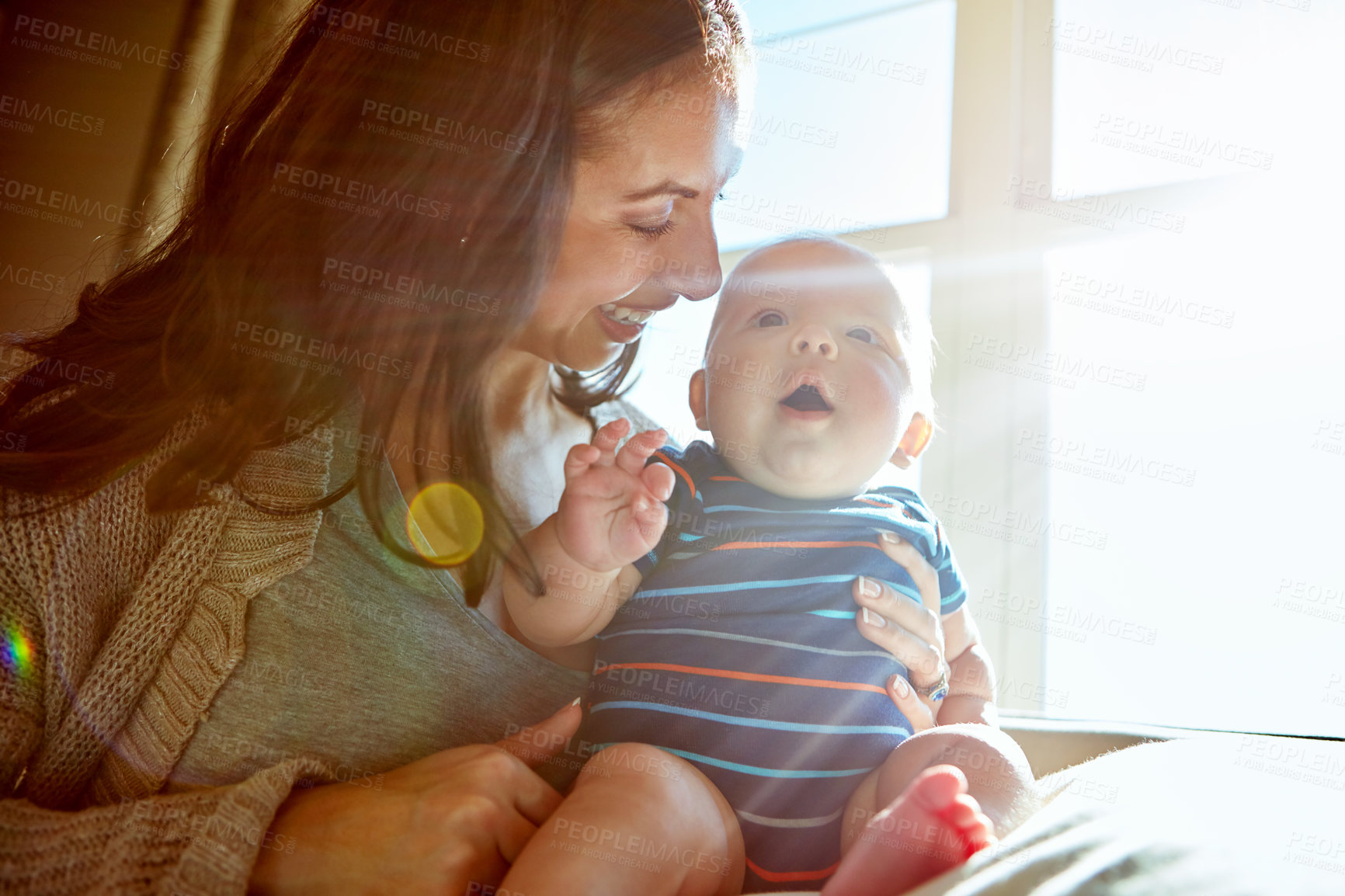 Buy stock photo Shot of a mother bonding with her baby boy at home