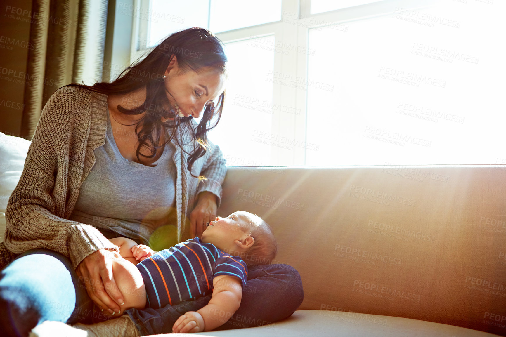 Buy stock photo Happy, mother and baby on sofa relax on weekend for love, bonding and relationship development in home. Care, woman and child together on couch in summer for safety, support or play in living room