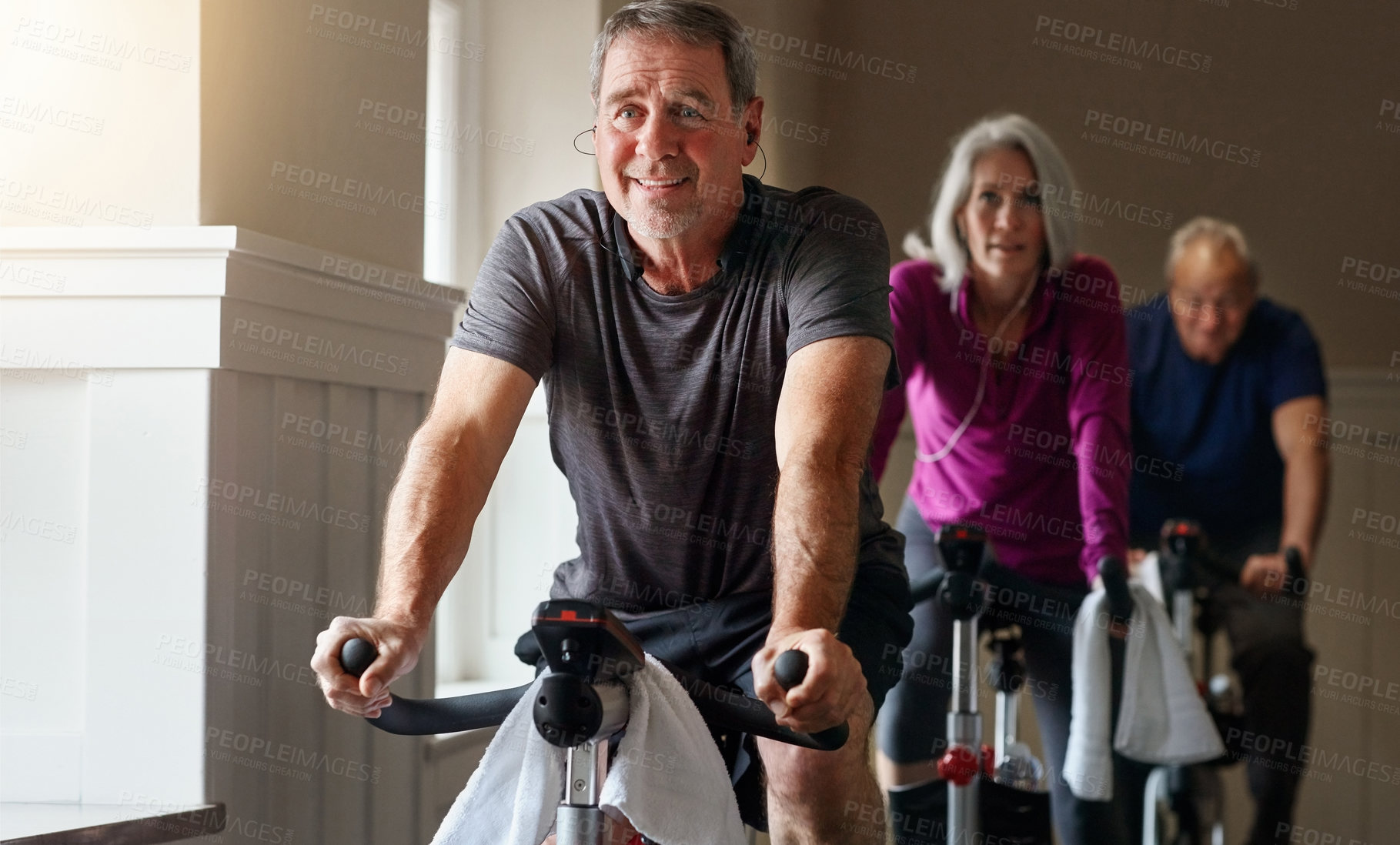 Buy stock photo Exercise, spinning class and mature people in gym for cycling, fitness and training with physical activity. Workout club, men and woman on bicycle for health, wellness and endurance with cardio