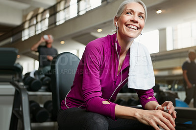 Buy stock photo Portrait of a happy senior woman taking a break from her workout at the gym