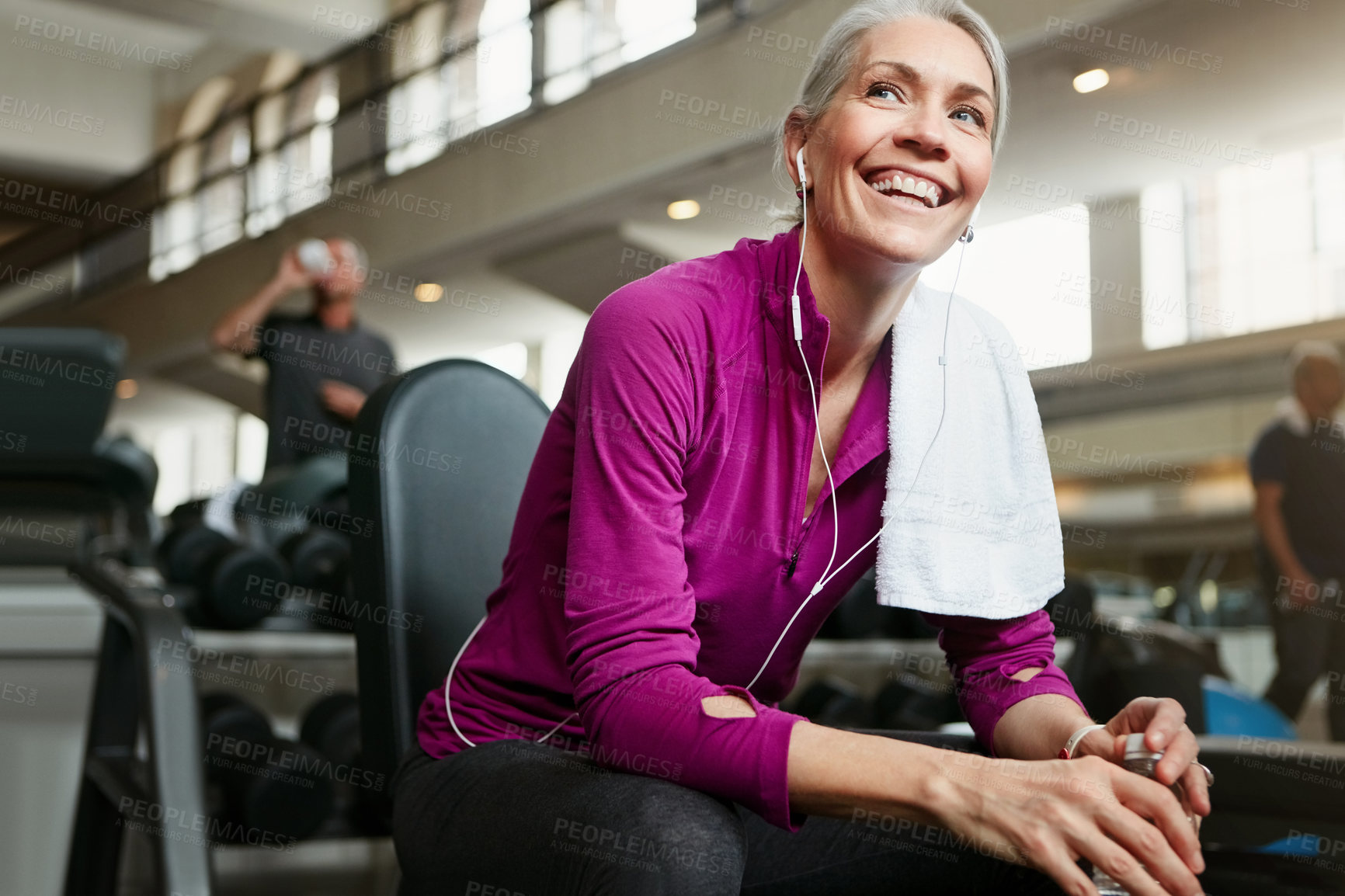 Buy stock photo Fitness, music and senior woman in gym with water bottle for training, exercise and workout. Sports, retirement and person with liquid, minerals and listening to song for wellness, health and rest