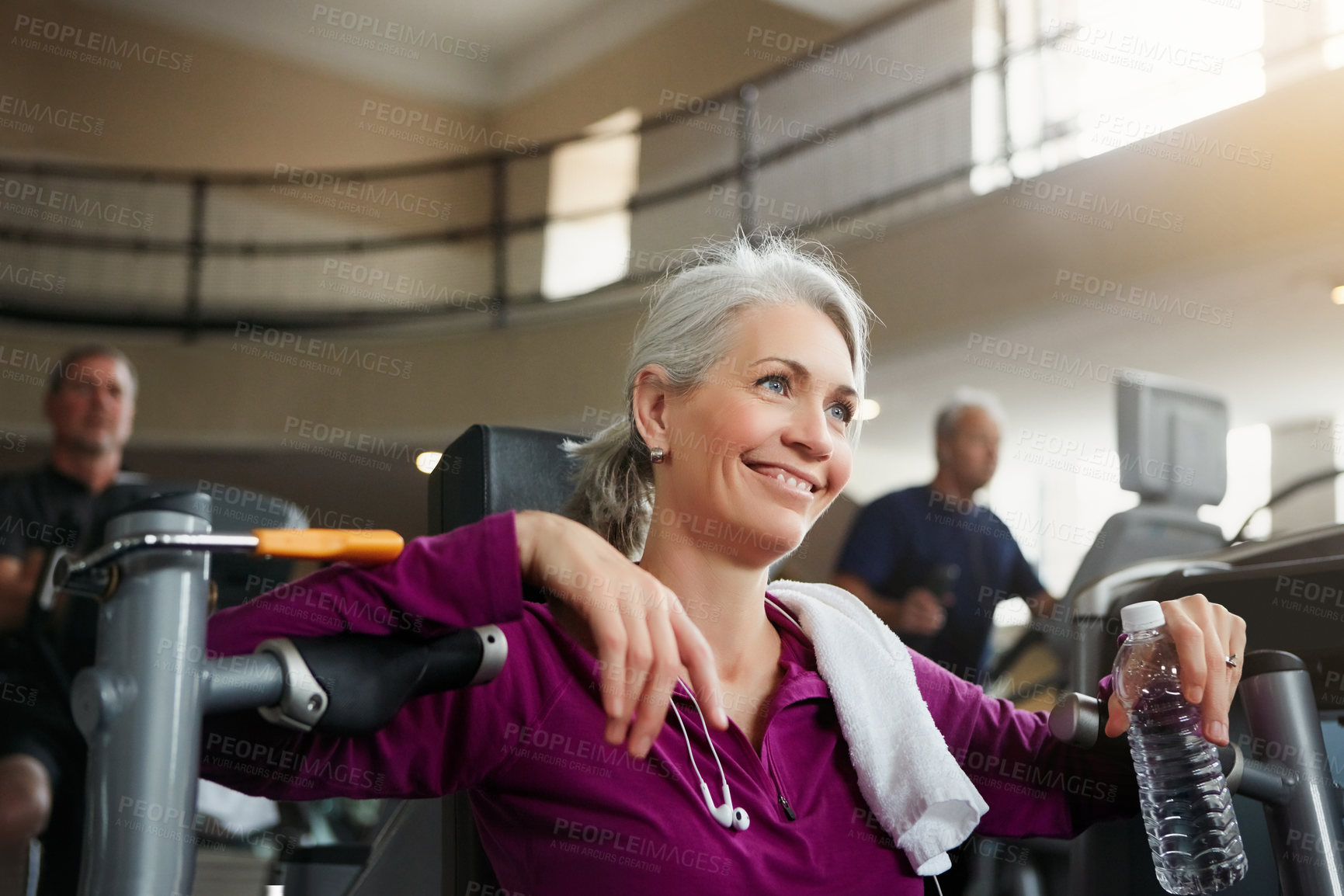 Buy stock photo Woman, tired and break from exercise in gym, fitness and water for chest press machine or rest. Female person, mineral liquid and nutrition at health club, mature and sweat or relax after workout