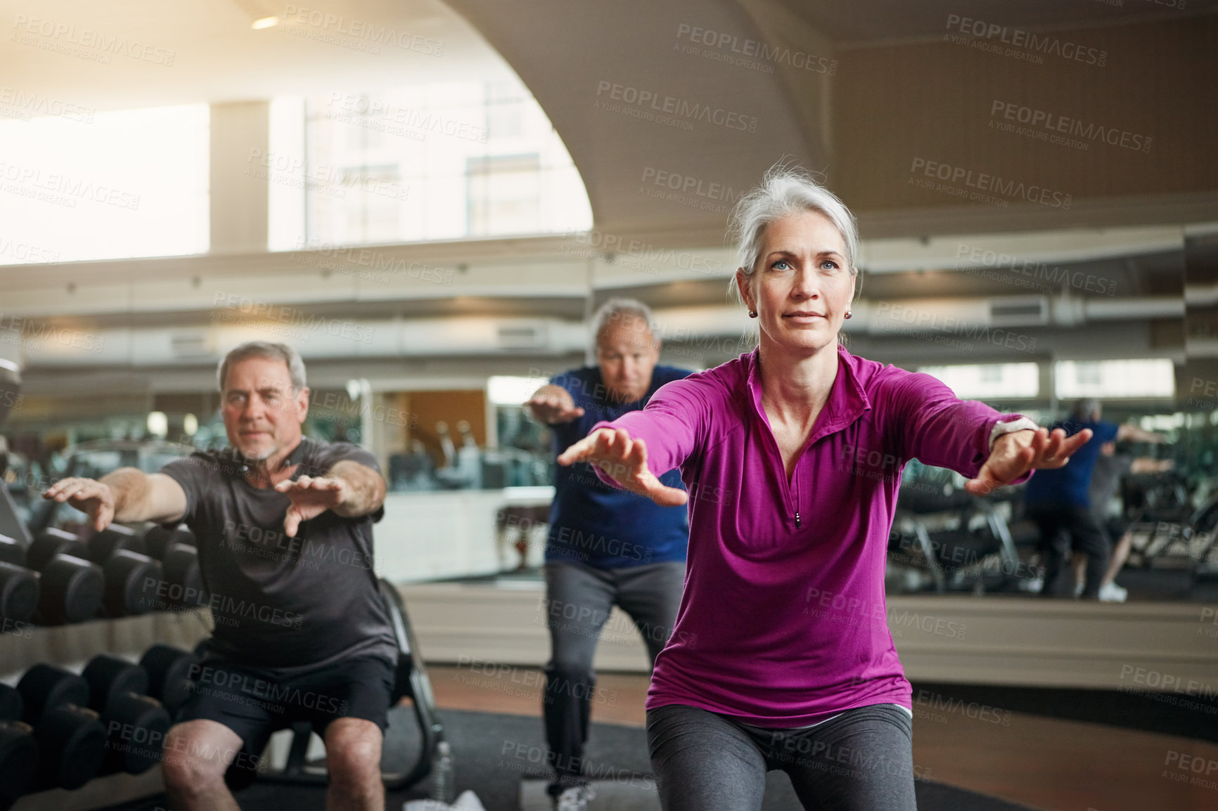 Buy stock photo Mature group, woman and squat with fitness in gym, balance or coach for muscle development in class. Senior group, men and exercise for legs, health or workout together in retirement at wellness club