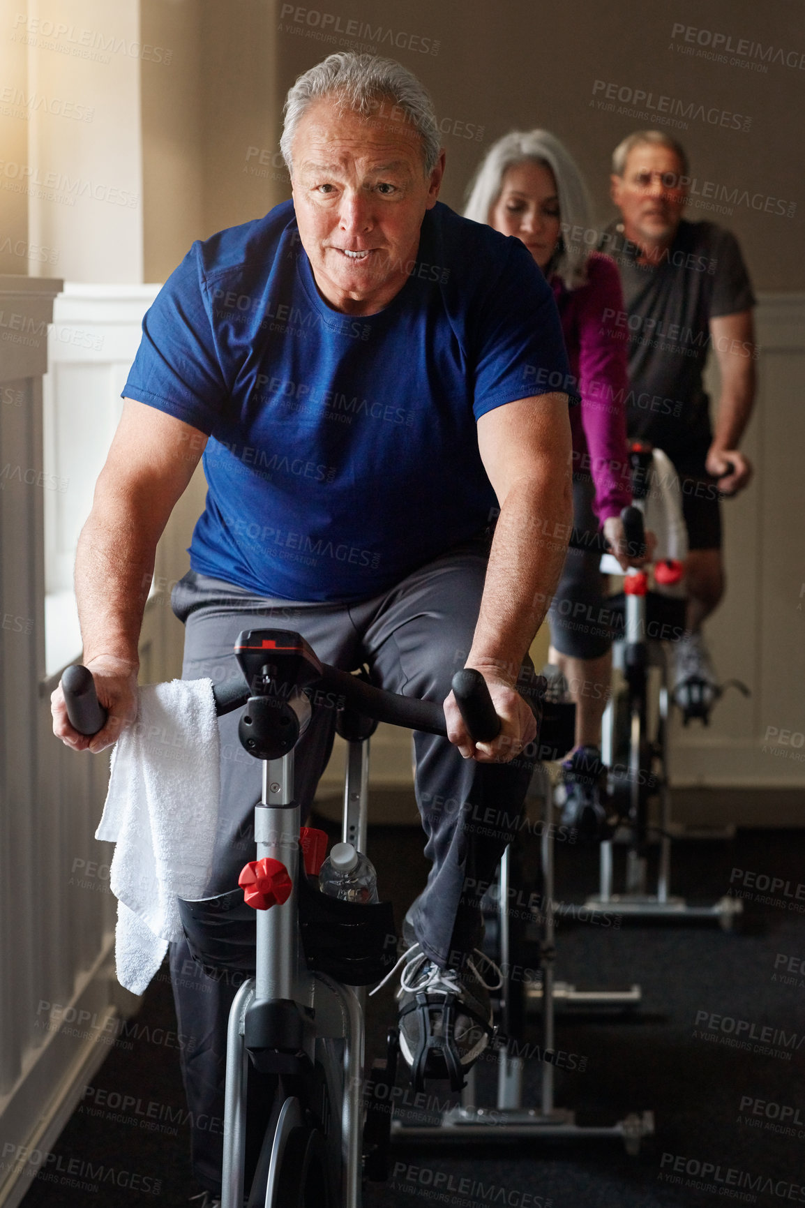 Buy stock photo Spin class, mature or man on exercise bike in workout or cardio training for energy, health or wellness. Active, performance or sports person on bicycle machine for fitness, gym challenge or cycling