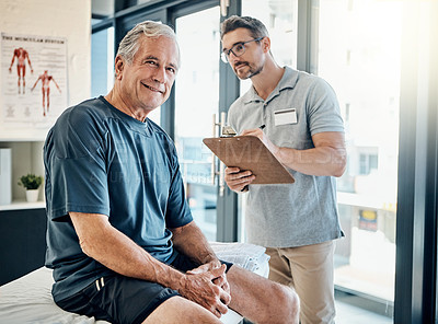 Buy stock photo Portrait of a mature man smiling during a consultation with his physiotherapist in the rehabilitation center