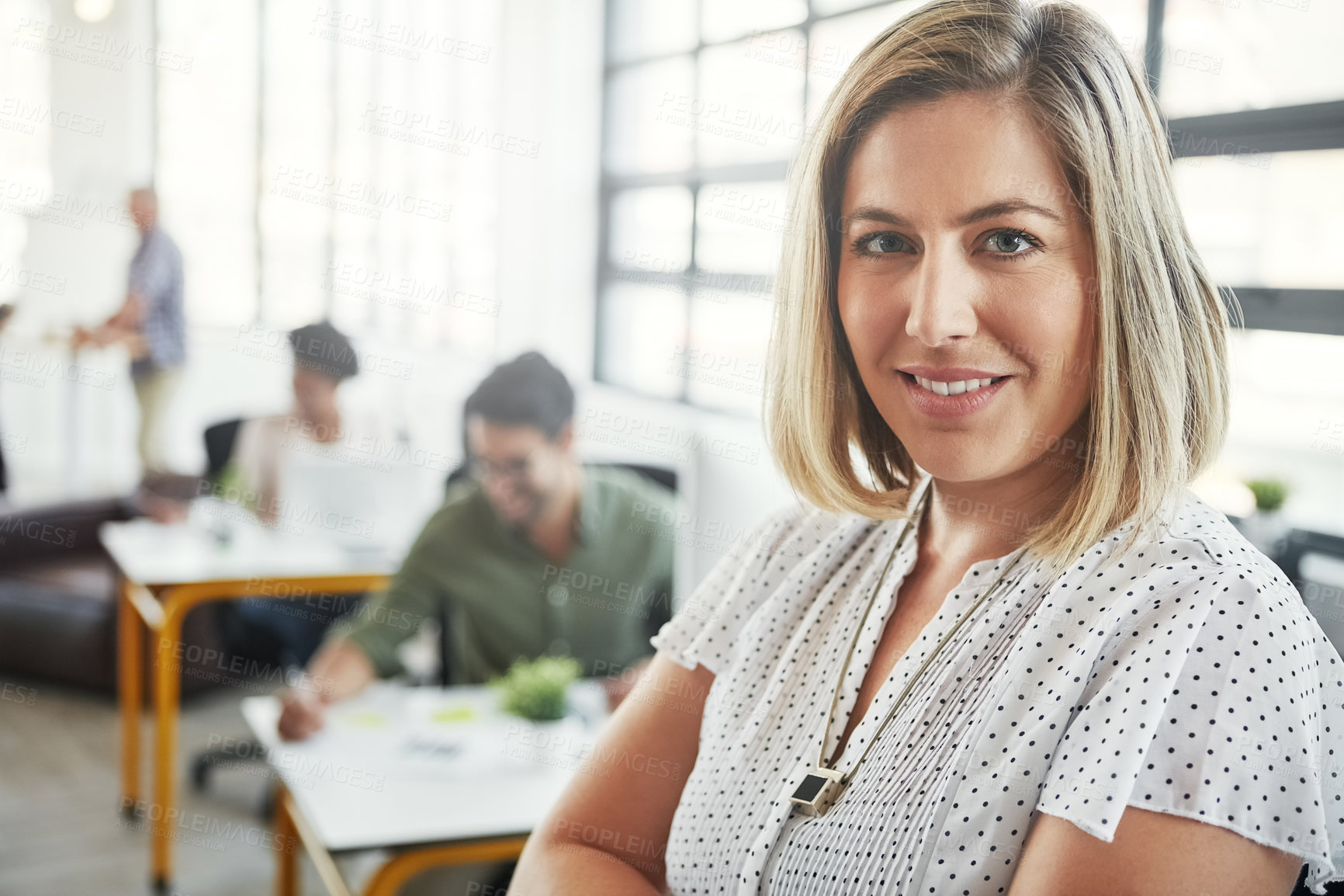 Buy stock photo Woman, office portrait and happy with arms crossed with business people, success or vision at web design company. Creative woman, motivation and leader for career goals, mission and smile in New York