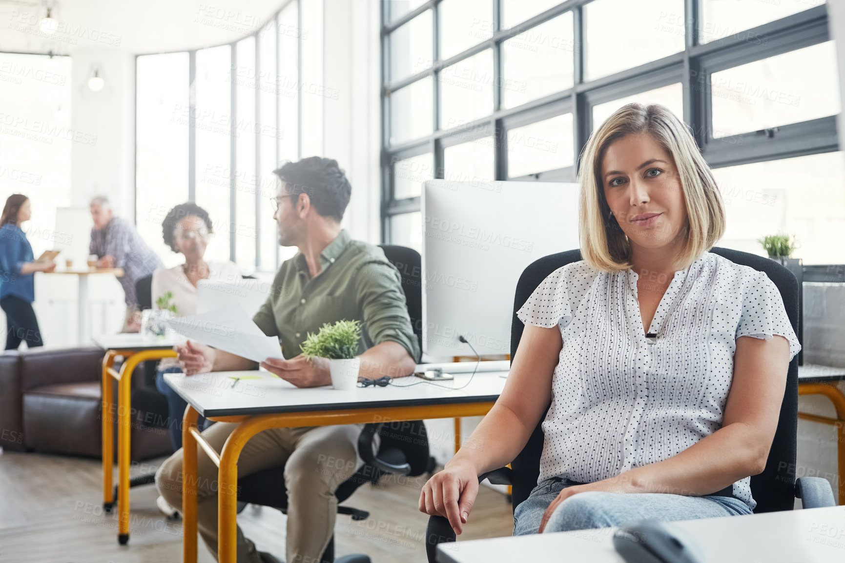 Buy stock photo Business woman, leadership and smile at desk with career vision or ambition at the office. Portrait of young female designer smiling in management for job, profession or occupation at the workplace