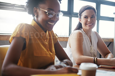 Buy stock photo Shot of a team of happy business colleagues discussing a project around a table in their office