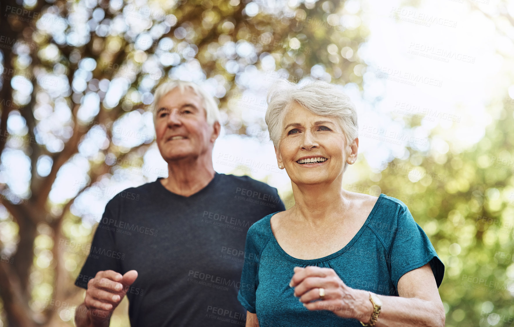 Buy stock photo Shot of a senior couple out for a run together