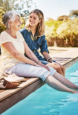 Buy stock photo Women relax together, happy and swimming pool, love with care and quality time during summer vacation. Elderly mother, daughter and vacation, outdoor pool and wellness lifestyle with happy family