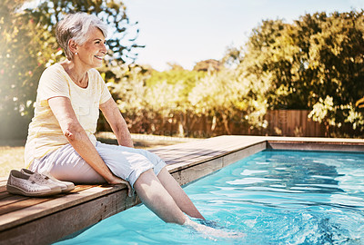 Buy stock photo Happy elderly woman with her feet in the pool while on a vacation, adventure or outdoor trip in summer. Relax, smile and senior lady in retirement by swimming pool at a holiday resort in Australia.