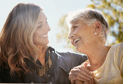Buy stock photo Family, love or happy with a senior mother and daughter bonding outdoor together during a summer day. Smile, flare and retirement with a young man hugging her elderly parent outside in the park