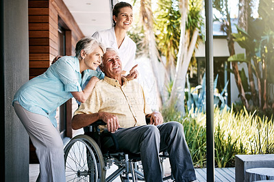 Buy stock photo Shot of a senior couple and a nurse outside a retirement home