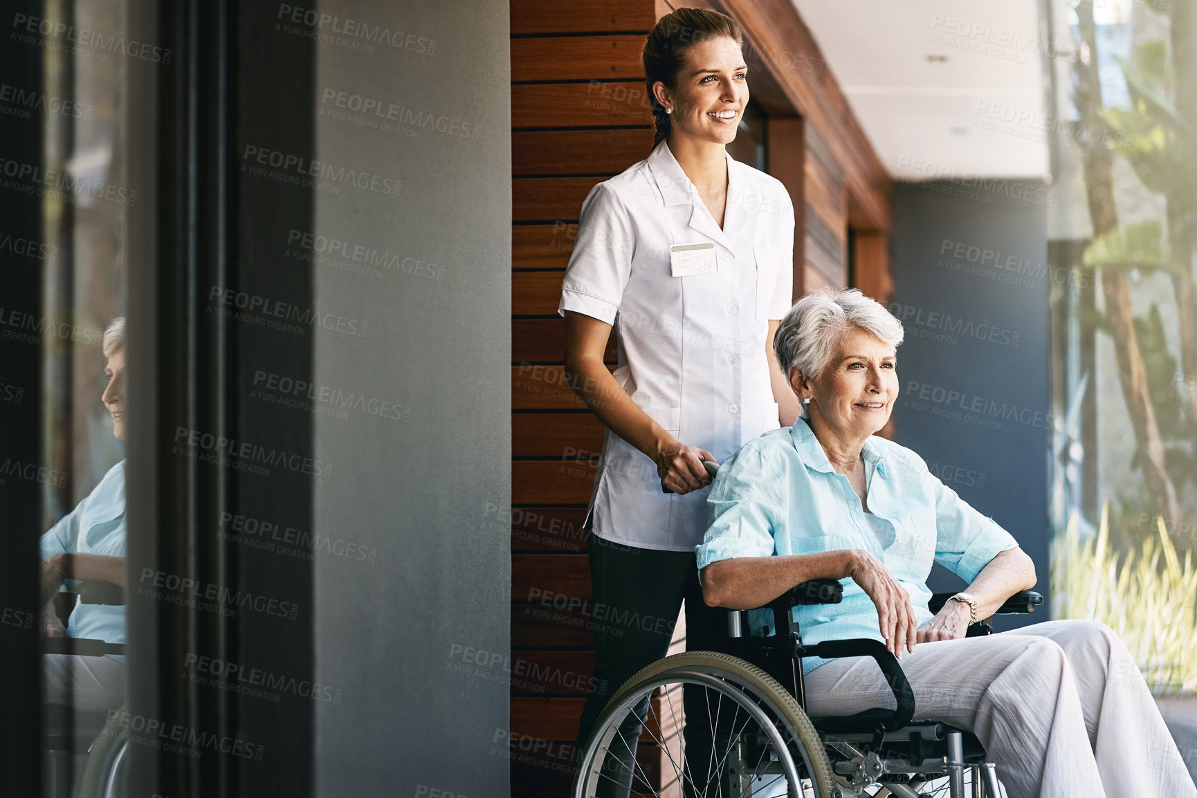 Buy stock photo Caregiver, senior woman and help on wheelchair for support, rehabilitation or medical healthcare of patient. Happy nurse, retirement and person with disability at home for recovery, wellness and care