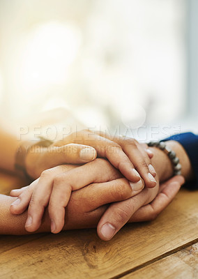 Buy stock photo Holding hands, mockup and closeup with trust, solidarity and community on a home table. Therapy, care and gratitude of friends together with hope, respect and love for grief empathy and forgive