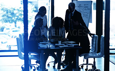 Buy stock photo Shot of a group of corporate businesspeople looking at a tablet together during a meeting in the boardroom
