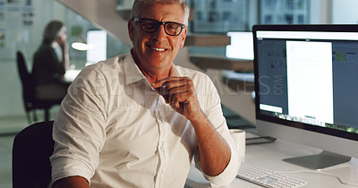 Buy stock photo Cropped portrait of a mature businessman sitting at his desk in the office