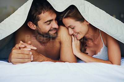 Buy stock photo Shot of a young couple looking at the results on a pregnancy test