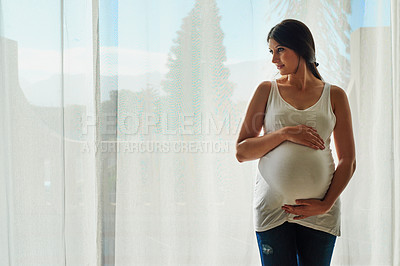 Buy stock photo Pregnancy, happy and woman by window in home hold stomach for love, prenatal care and support in morning. Family, pregnant and person hug tummy for wellness, baby health and maternity in living room