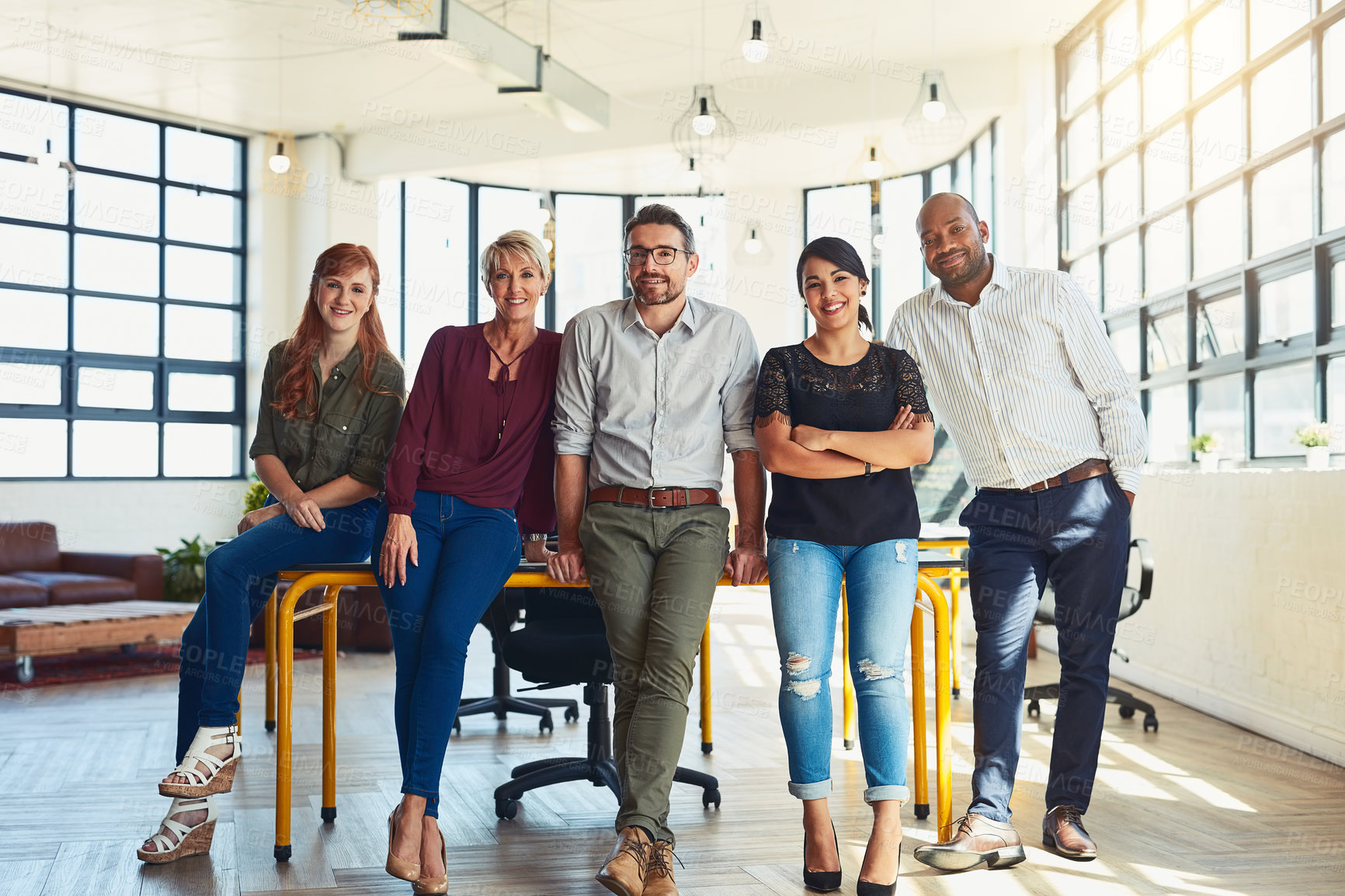 Buy stock photo Portrait of a group of designers standing in an office