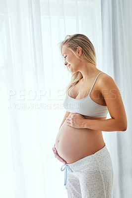 Buy stock photo Woman, bedroom and happy with pregnancy in home to relax, feel and bonding with unborn baby. Female person, rest and smile for maternity leave or break with love, care and pregnant with support