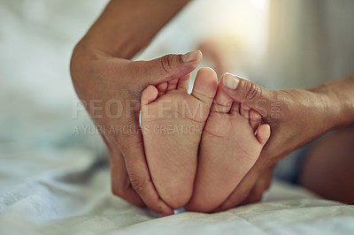 Buy stock photo Shot of an unrecognizable mother and her child's feet at home