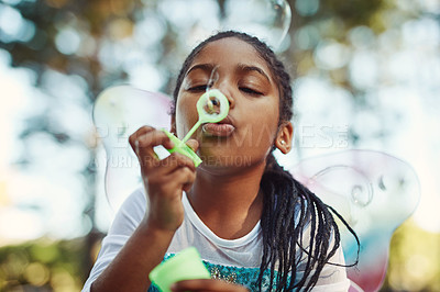 Buy stock photo Nature, princess costume and girl with bubble for playing fantasy, childhood games and happiness. Forest, fairy tale and face of African child in woods blowing bubbles for adventure, magic and fun