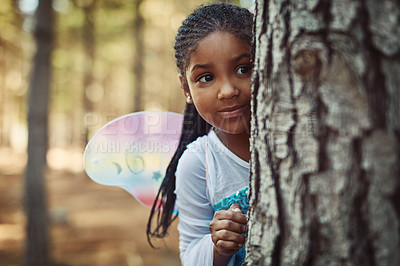 Buy stock photo Shot of a little girl dressed up as a fairy and playing in the woods