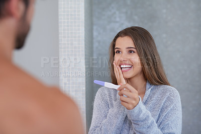 Buy stock photo Couple, pregnancy test and shock for results in home, maternity kit and happy for outcome in bathroom. People, together and support to check for baby news, wow and ivf success for fertility stick