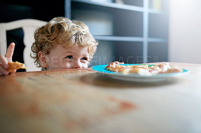 Buy stock photo Shot of an adorable little boy eating at home