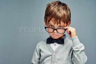 Buy stock photo Studio portrait of a smartly dressed little boy posing with attitude against a gray background