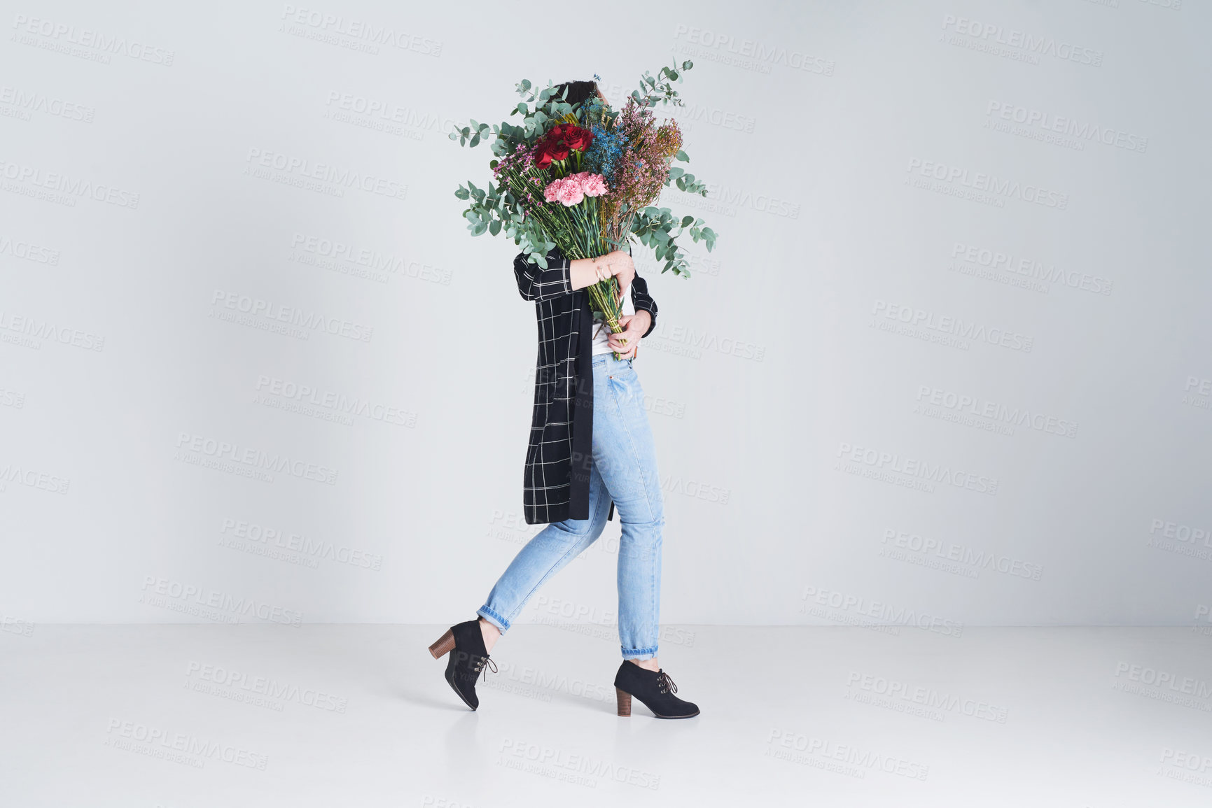 Buy stock photo Spring, woman and flowers in studio for gift with walking or eco friendly arrangement with gray background. Person, floral bunch or hide face with present, bouquet or mockup space with sustainability