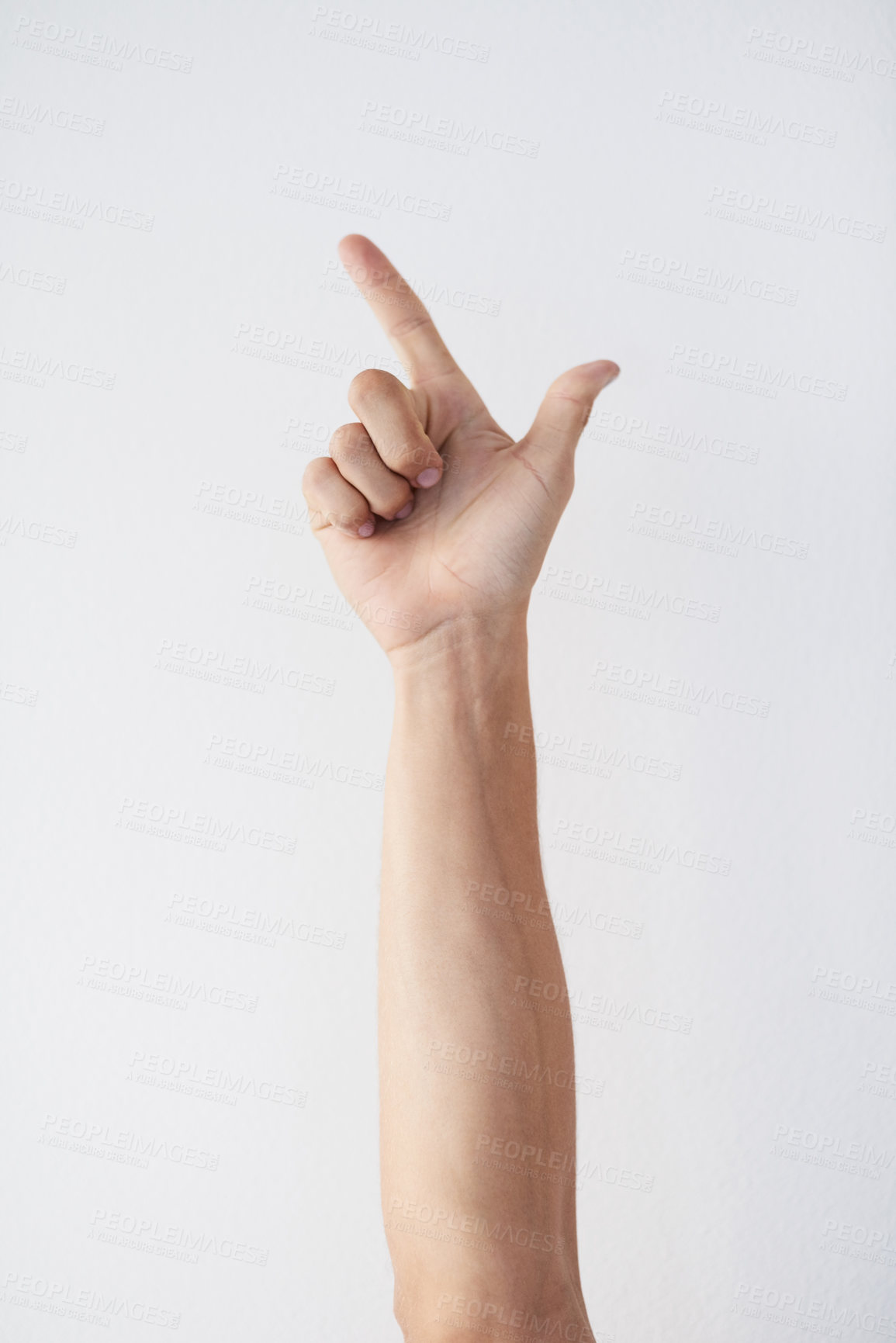 Buy stock photo Cropped shot of a unrecognizable person's hands against a grey background showing a letter 