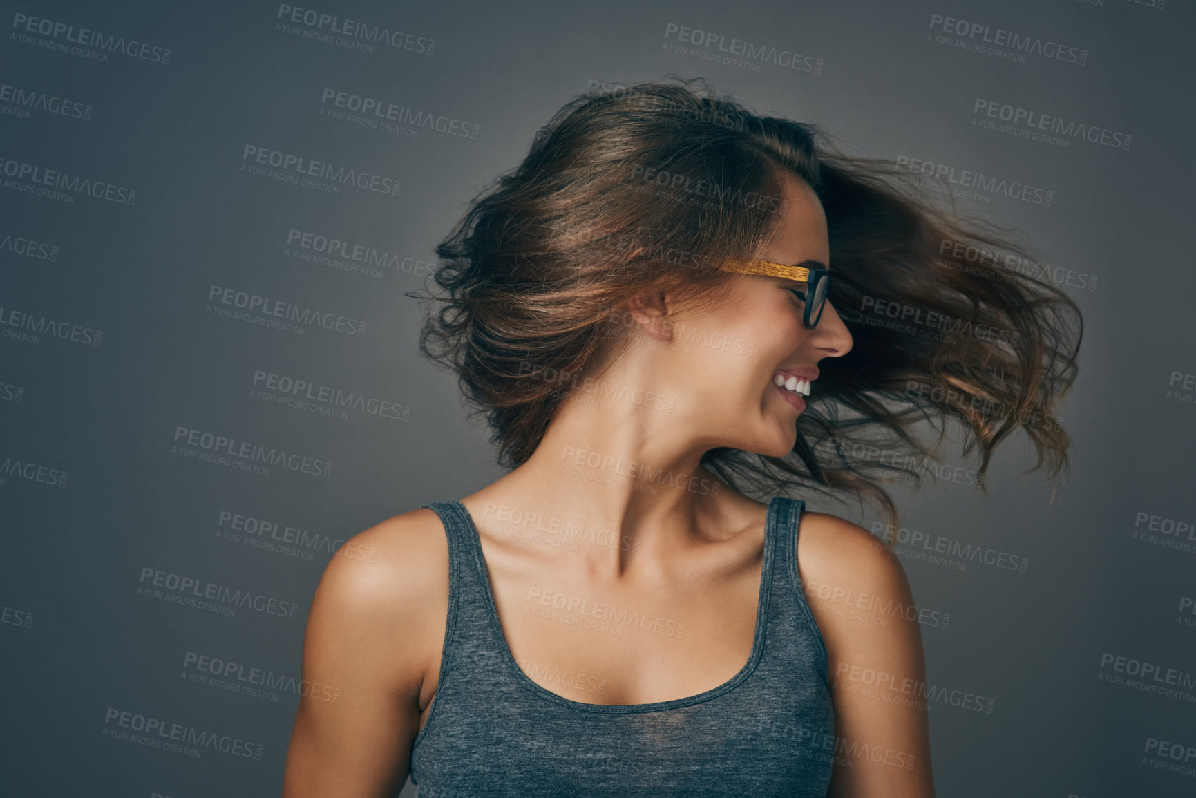 Buy stock photo Studio shot of an attractive young woman wearing glasses