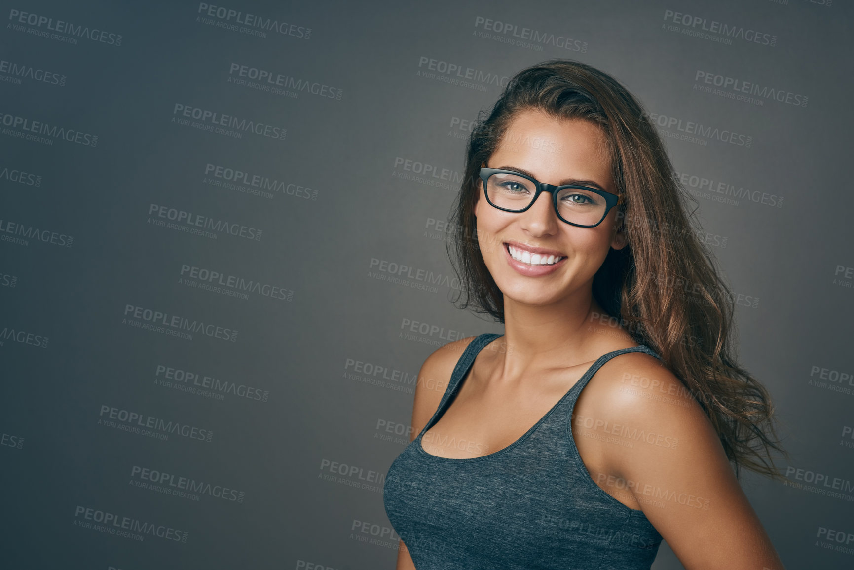 Buy stock photo Smart woman, glasses and portrait with happiness and mockup from eyewear. Gray background, studio and modern style with female person and model with beauty and casual fashion with smile and eye care