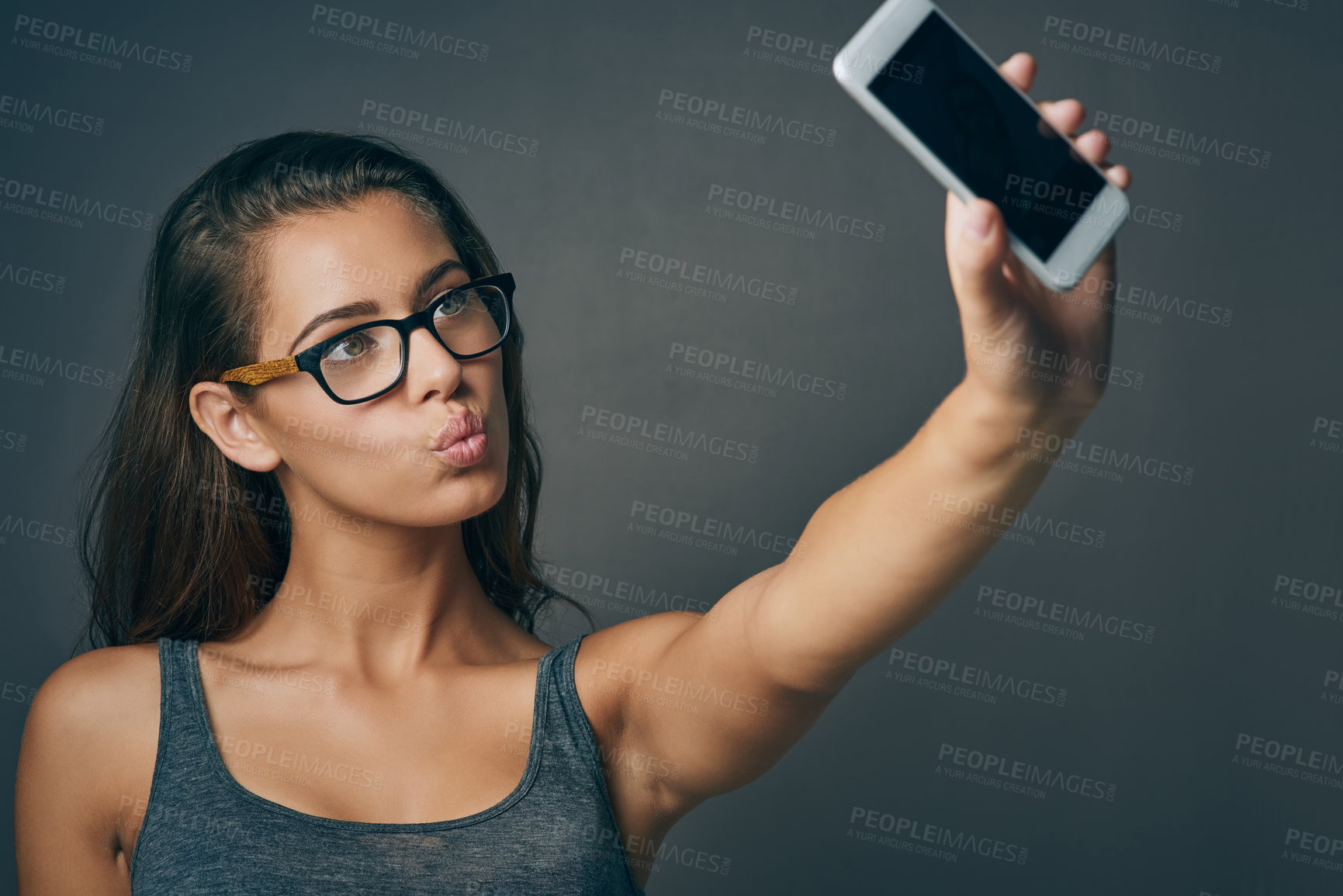 Buy stock photo Woman, studio and pouting with eyeglasses on selfie on grey background for eyesight and eyewear prescription. Female person, serious and confident with social media post or profile picture with frame