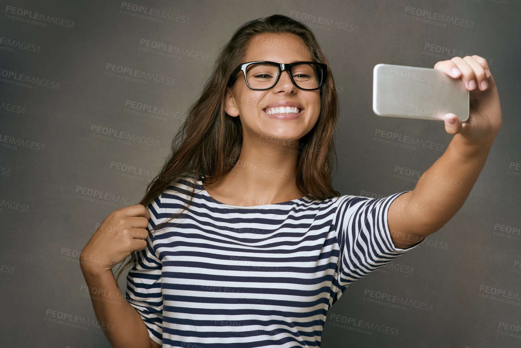 Buy stock photo Woman, glasses and selfie with smile, optometry and confidence on gray studio background. Female person, memory and happy for eyewear, social media and eye care with post, clear vision and frame lens