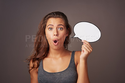 Buy stock photo Speech bubble, surprise and portrait of woman in studio for omg news, opinion and feedback. Mockup space, social media and person with sign for information, announcement and emoji on dark background