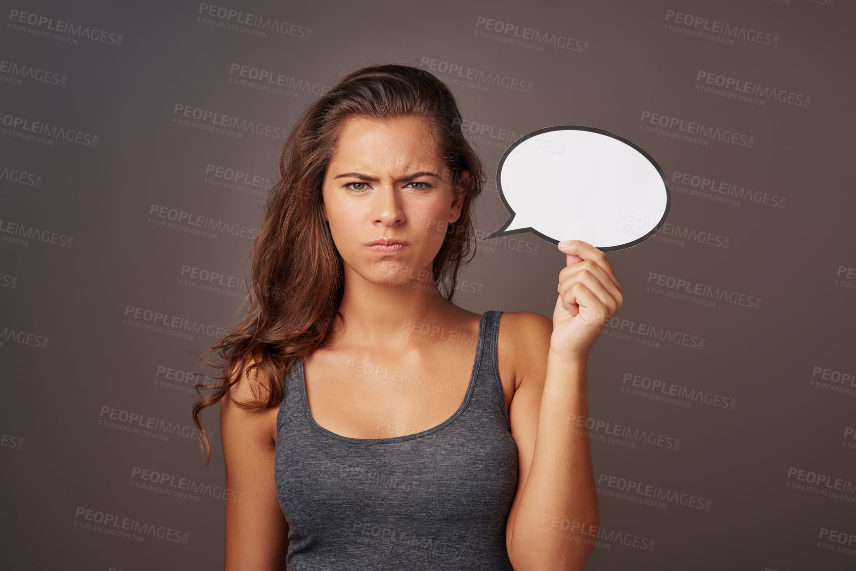 Buy stock photo Woman, speech bubble and angry in studio background for product advertisement, promotion and sale. Girl, unhappy and portrait with sign board for instructions, information and tips in mockup