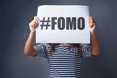 Buy stock photo Poster, paper and hands of woman in studio with text, information and advertising of insecurity. Announcement, sign and female person with anxiety on gray background for fomo, problem and awareness