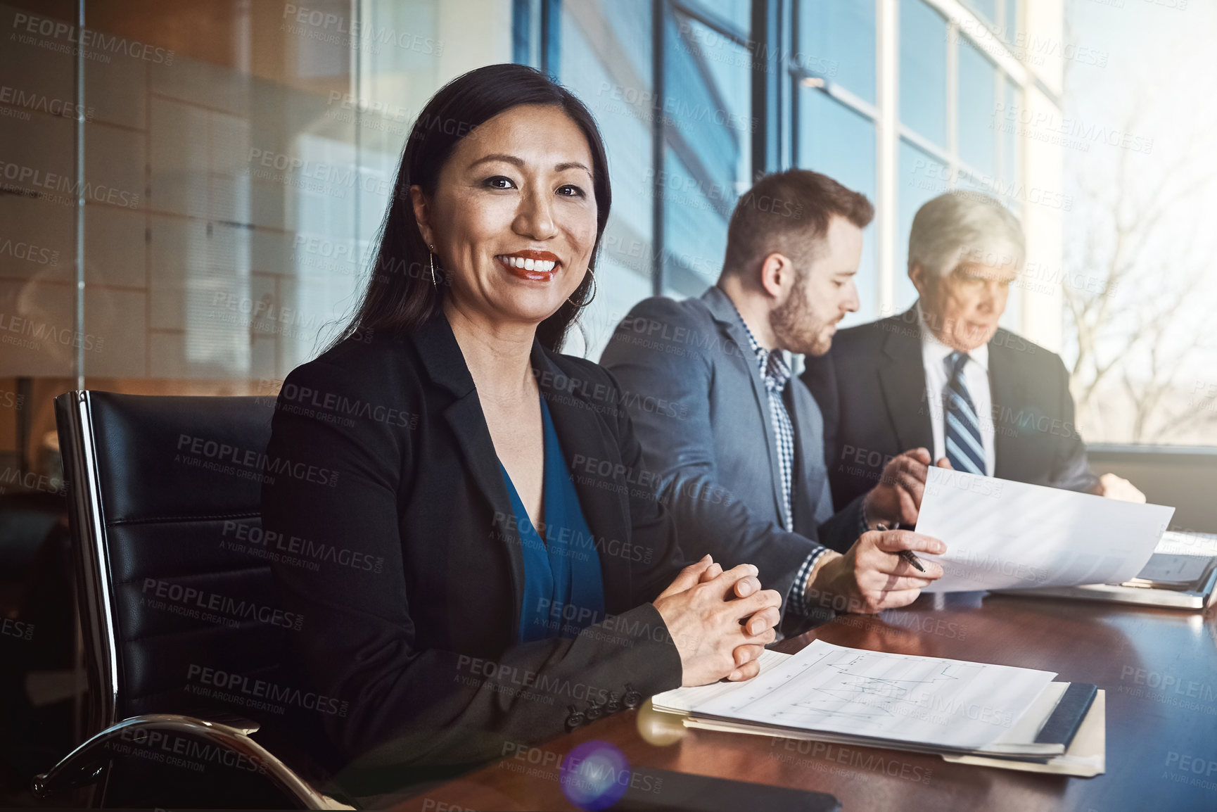 Buy stock photo Cropped portrait of a mature businesswoman sitting in the boardroom during a meeting