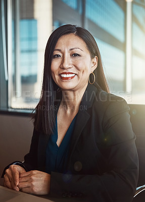 Buy stock photo Cropped portrait of a mature businesswoman working in her office