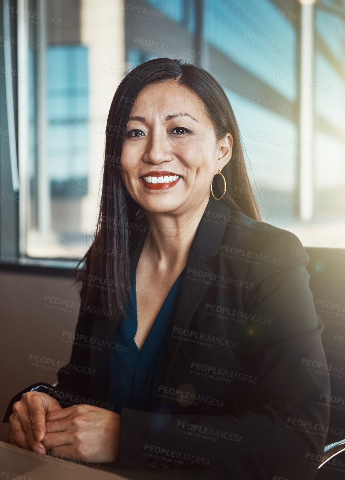 Buy stock photo Cropped portrait of a mature businesswoman working in her office