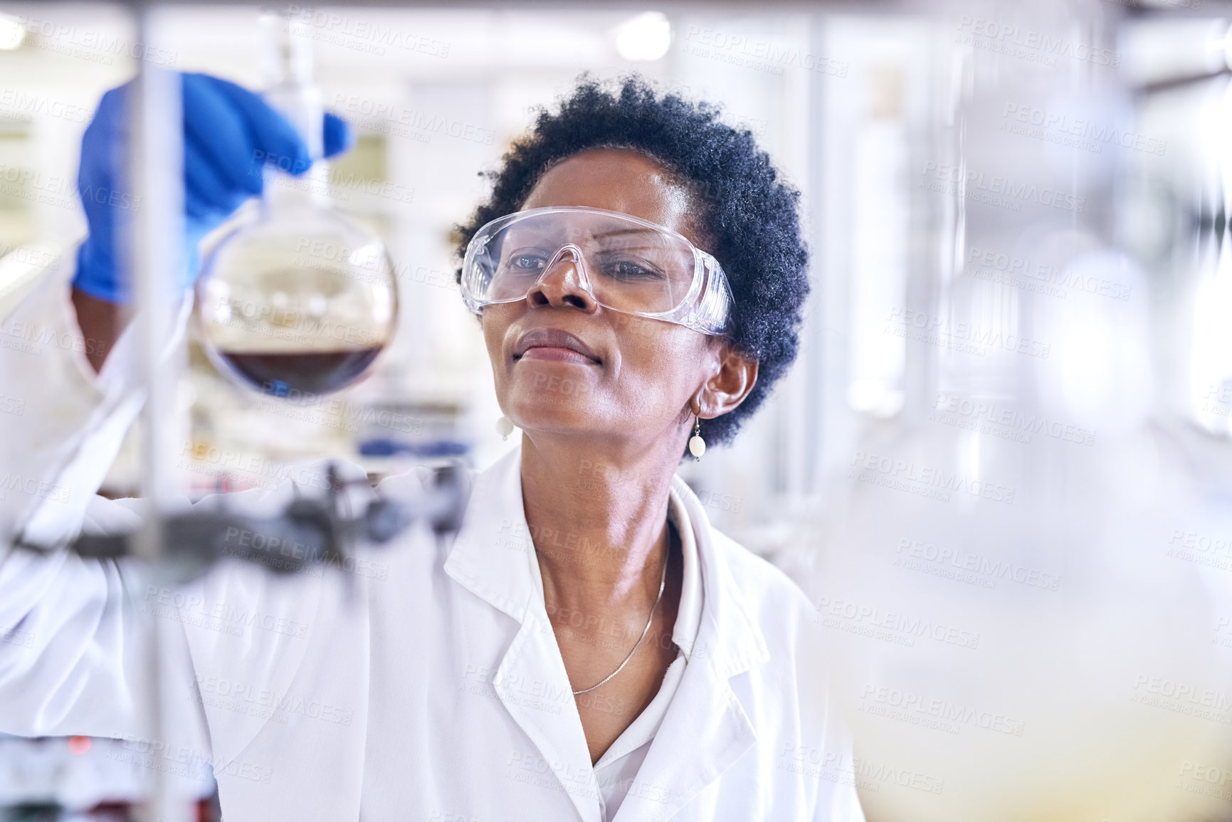 Buy stock photo Science, black woman or scientist in a laboratory with chemical liquid after chemistry research or scientific test. Physics, healthcare or medical doctor with acid solution for medicine development