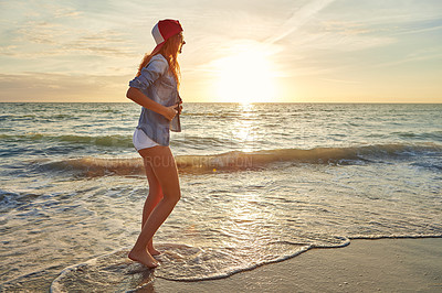 Buy stock photo Shot an attractive young woman enjoying a day at the beach