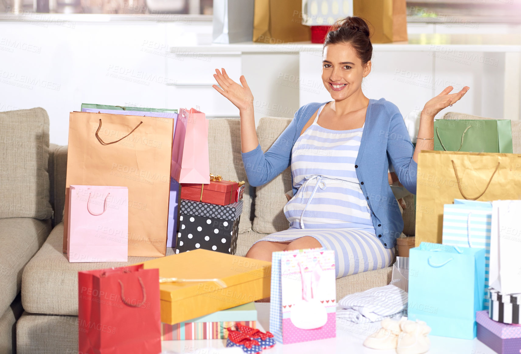 Buy stock photo Woman, portrait and gift at baby shower with celebration, congratulations and excited for new clothes at home. Pregnant mother, mom or parent with present and paper bag for wealth, party and security
