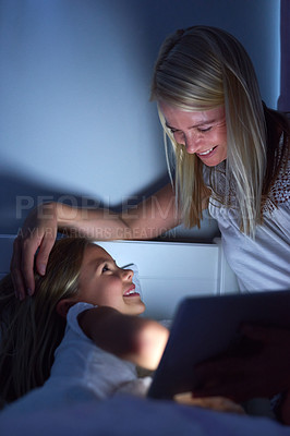 Buy stock photo Bedroom, night and mother with girl, tablet and ebook for reading, love and connection. Apartment, evening and family with mama, daughter and technology with digital app for story and house with care