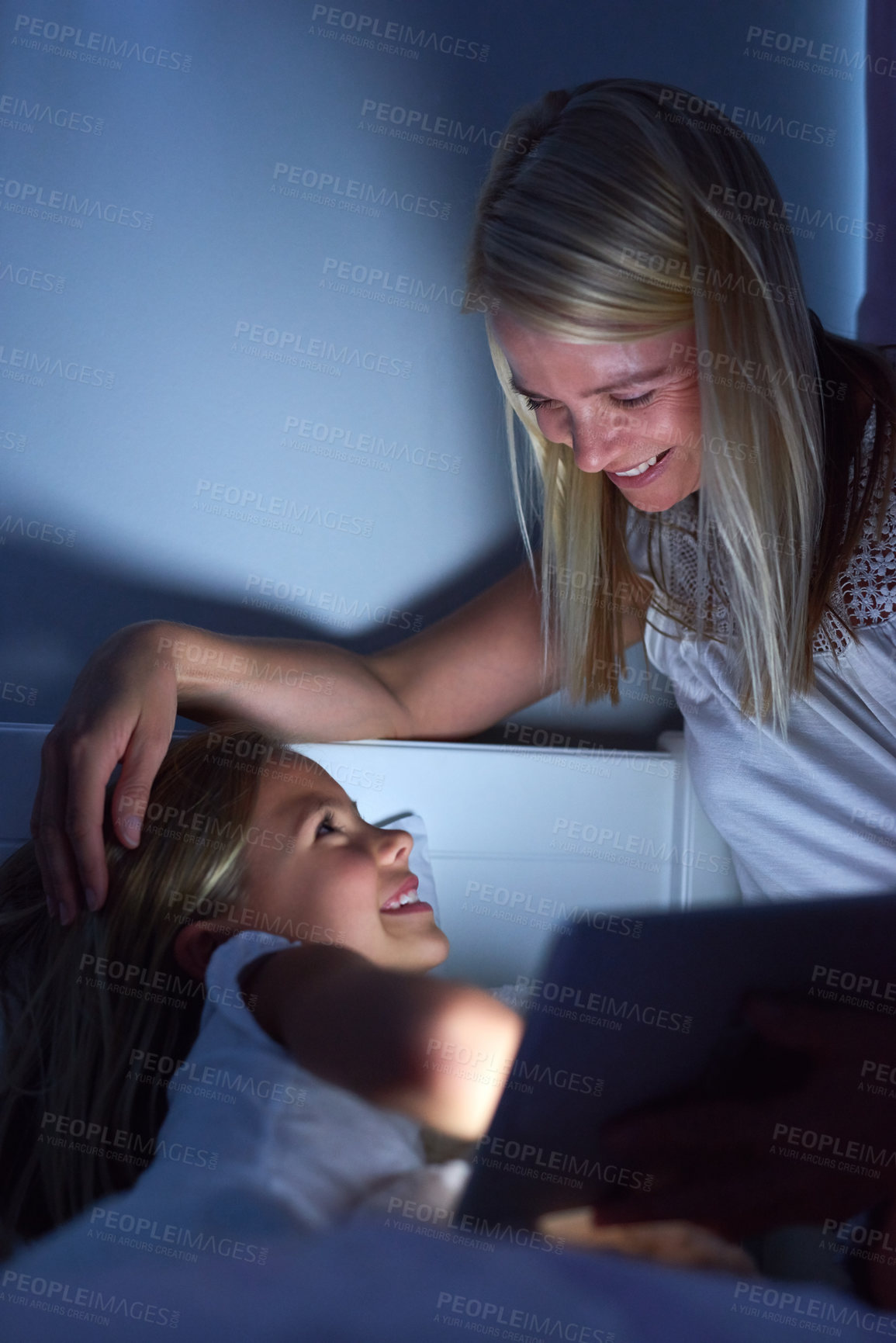 Buy stock photo Bedroom, night and mother with girl, tablet and ebook for reading, love and connection. Apartment, evening and family with mama, daughter and technology with digital app for story and house with care