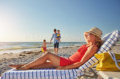 Buy stock photo Blue sky, woman and relax chair at beach with family adventure, sunshine and bonding in summer holiday together. Happy, mother and resting by ocean, travel and freedom of tropical vacation in Greece